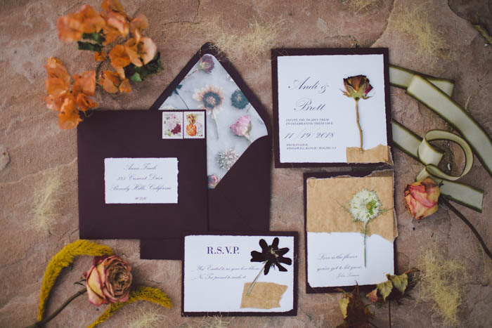 Fall wedding invititation suite in burgundy with pressed flowers and custom envelope liner