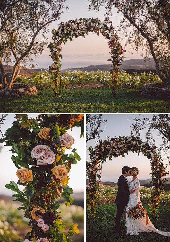 Romantic fall floral arch full of roses and dahlias in shades of blush, berry, burgundy and gold