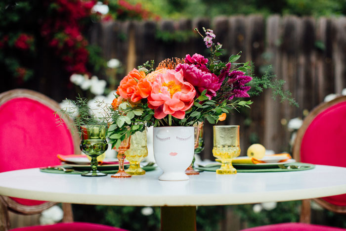 Bright tabletop with cute face vase!