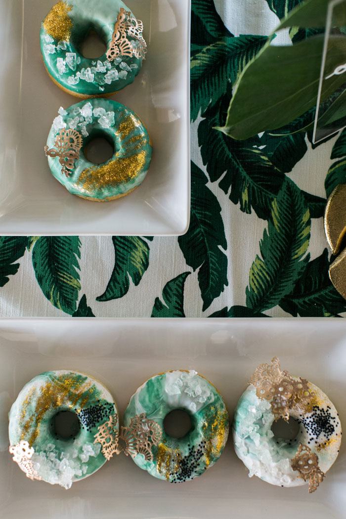 Tropical wedding desserts- gold leafed donuts.