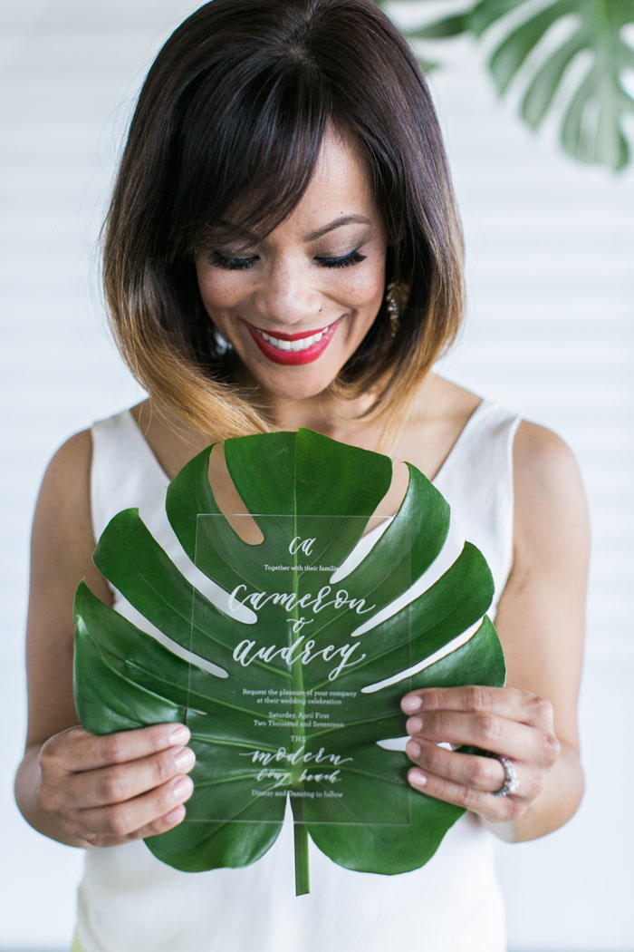 acrylic wedding invitation with monstera leaf