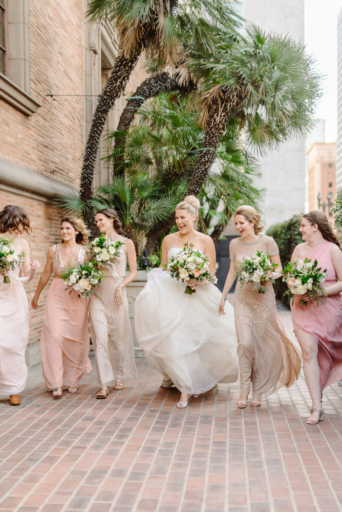 Blush and gold bridesmaids with beautiful neutral garden rose bouquets.