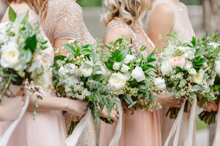 Blush + gold bridesmaids with garden fresh bridesmaids bouquets.