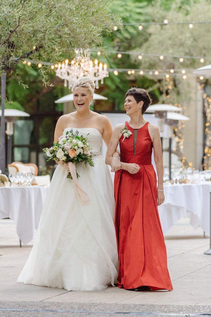 Mom walking bride down the aisle.