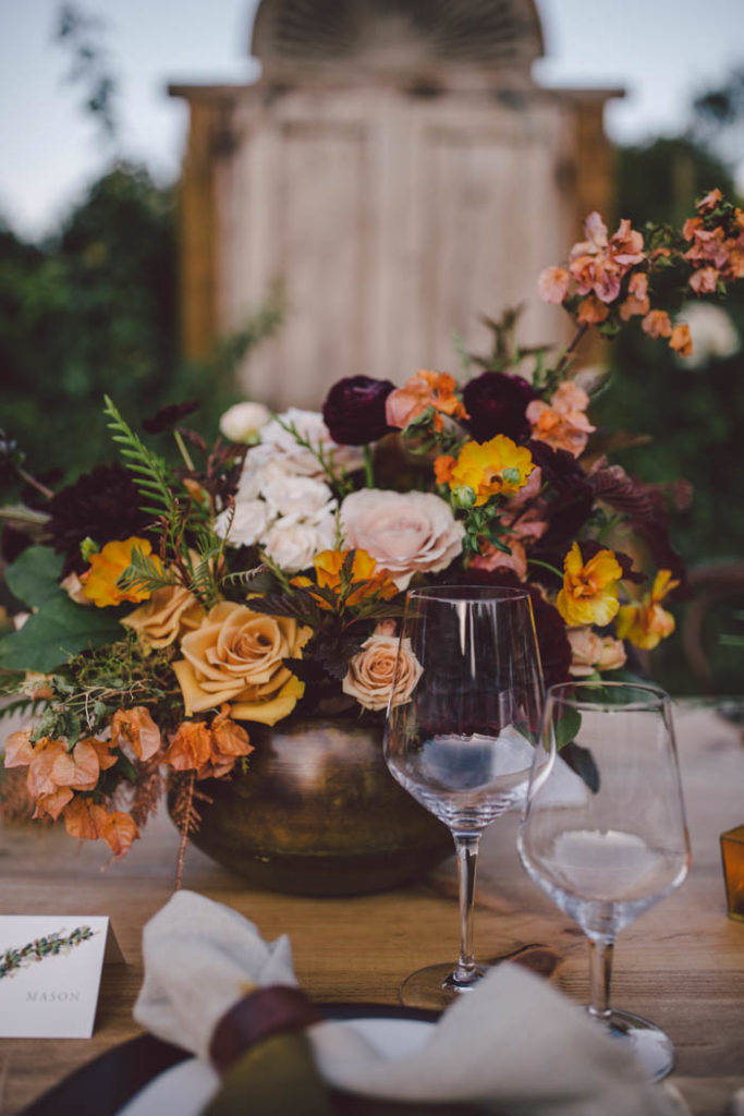 Fall Wedding Centerpiece featuring blush, peach, burgundy and gold flowers