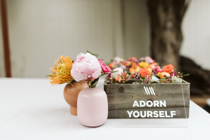 Winston & Main "Adorn Yourself" acrylic sign and modern brass wrist corsages