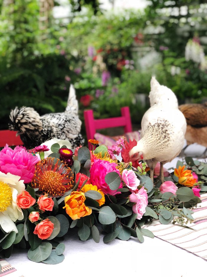 backyard chickens in lush floral garland