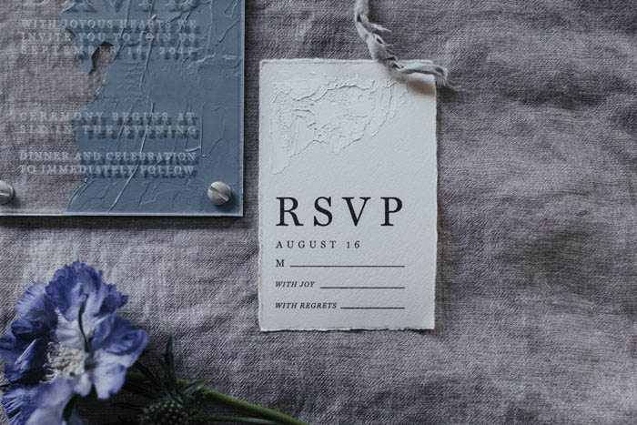 Unique acrylic invitations styled with scabiosa flower