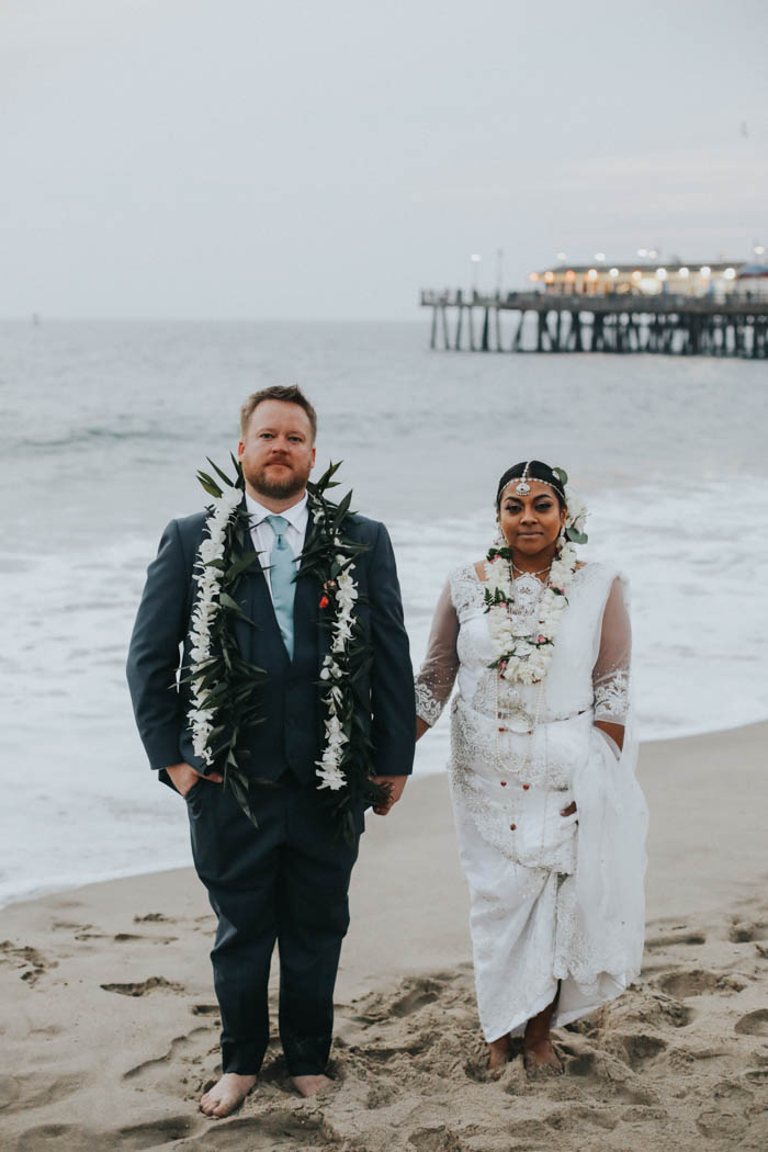 A private lei exchange on the beach featuring beautiful maile stye ti leaf lei and fragrant tuberose lei. 