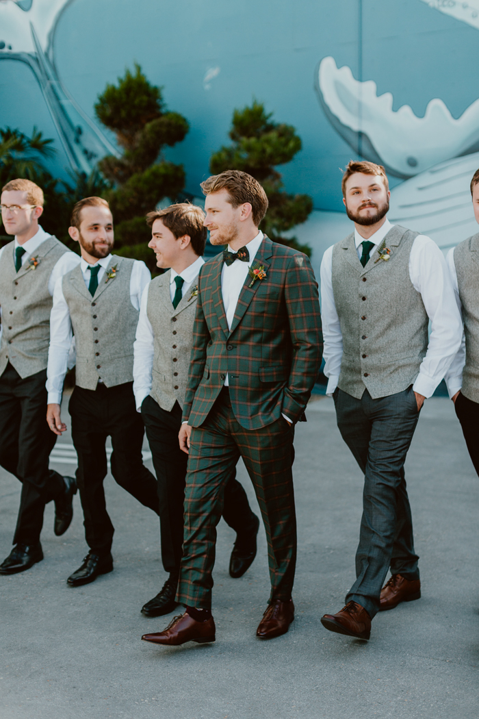The groom and wedding party wear tropical boutonnieres for the wedding at Valentine in downtown Los Angeles.