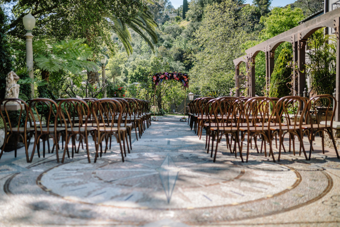 The Houdini Estate wedding featuring a floral ceremony arch by Winston and Main.