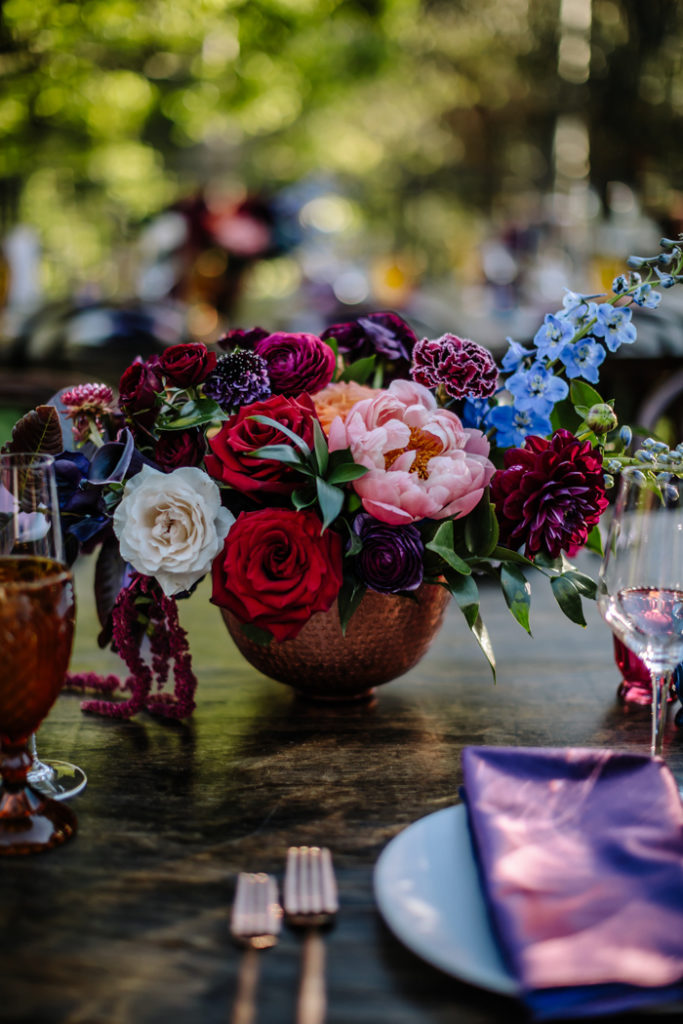 Lush jewel toned flower arrangements for a Houdini Estate wedding reception by Winston and Main