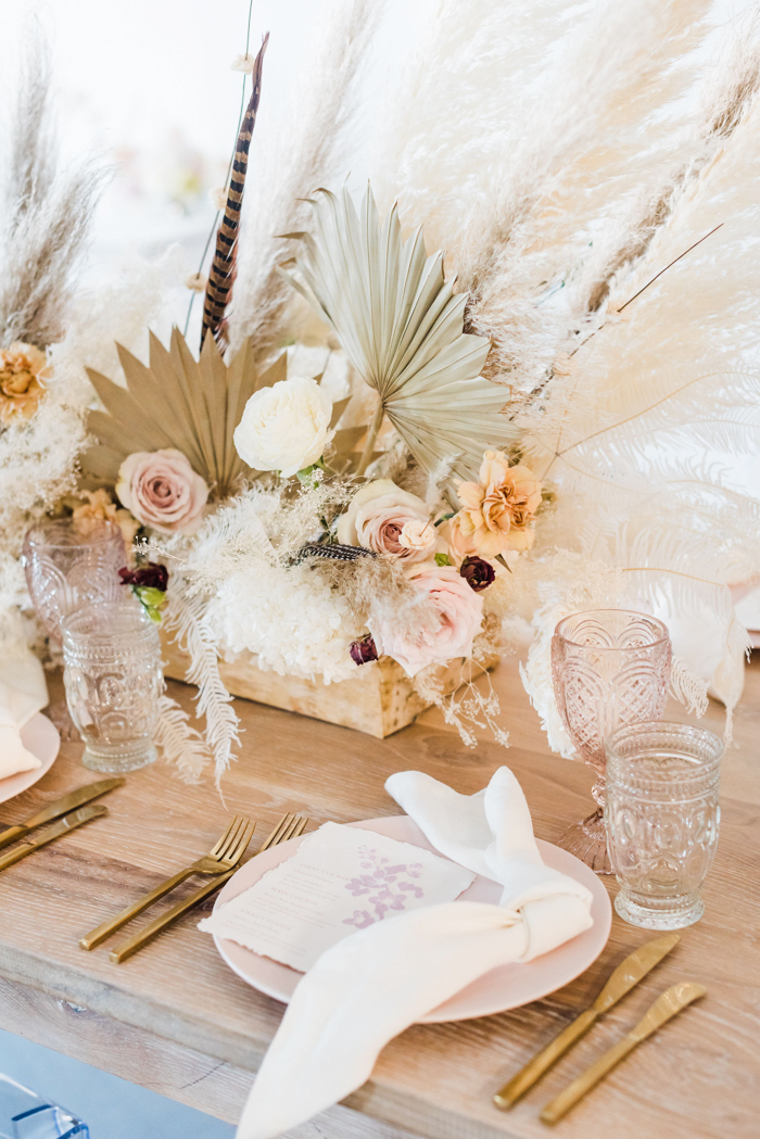 Ethereal bohemian table arrangement featuring natural tones and dry flowers.