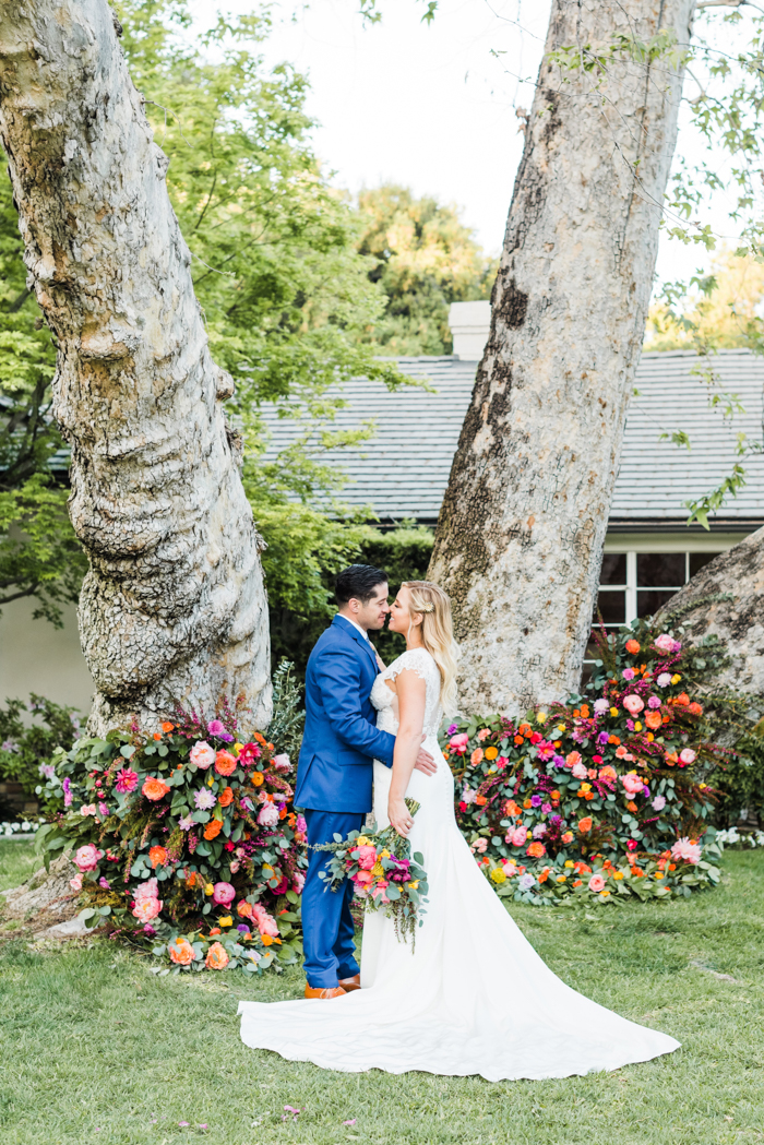 Large scale lush, colorful, and foam free floral installation on giant tree.