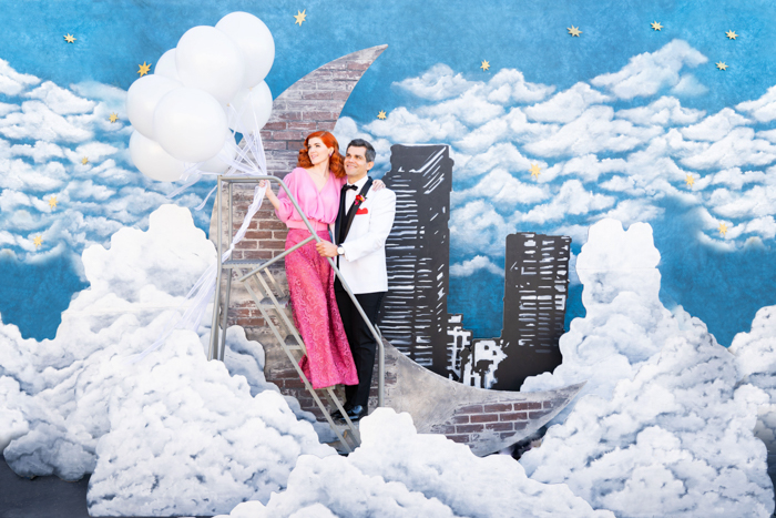 I Love Lucy inspired wedding featuring a beautiful hand painted backdrop and balloon bouquet.