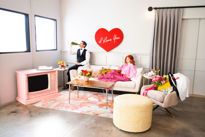 I Love Lucy inspired photoshoot featuring a pink television and bold bloom by Winston & Main.