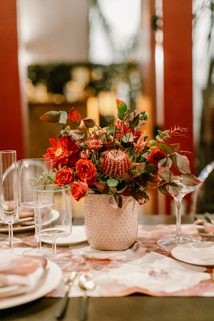 A wild and organic textural red floral arrangement by Tabitha of Winston & Main.