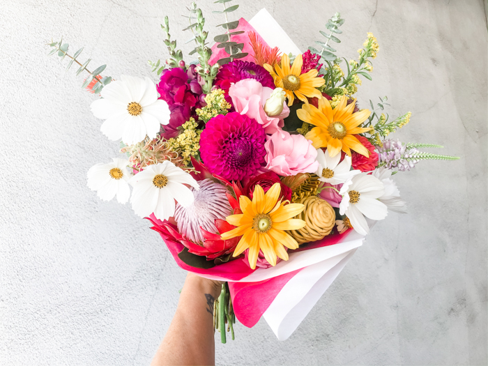 A bold and local bouquet by Tabitha Abercrombie of Winston & Main, featuring dahlias, cosmos, and rudbeckia.