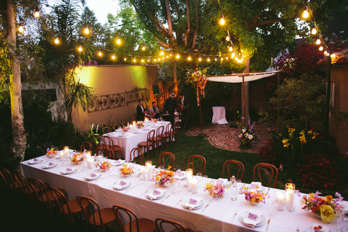 A private residence transformed into a whimsical garden wedding with beautiful spring florals designed by Winston & Main, featuring Claire De Lune Peonies, Poppies, and whimsical accent blooms in shades of lavender, orange, & yellow.