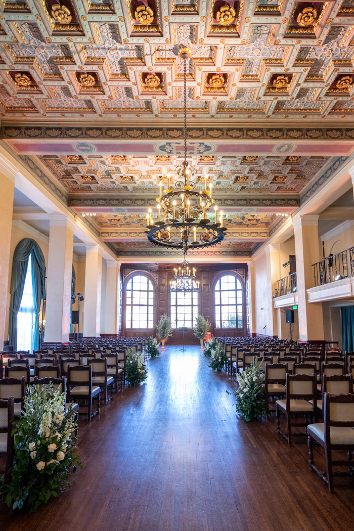 The historic setting of The Ebell of Los Angeles' ballroom is transformed into a modern ceremony space by floral designer, Winston & Main.