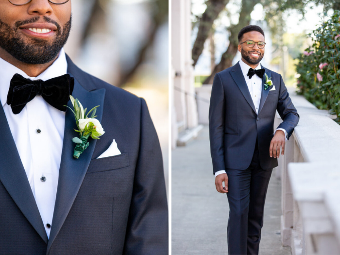 A portrait and close up of our groom wearing a custom boutonnière made of white ranunculus and olive leaves, wrapped with dark green, velvet ribbon.